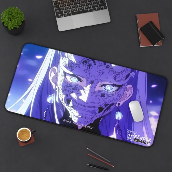 A large anime-themed gaming mouse pad featuring a character named "Aiko Moonstone" with long silver hair, wearing an intricate demon mask with glowing blue eyes. The pad is placed on a dark desk alongside a laptop, a cup of coffee, and stationery. The "Render Revolt" logo is visible in the corner.