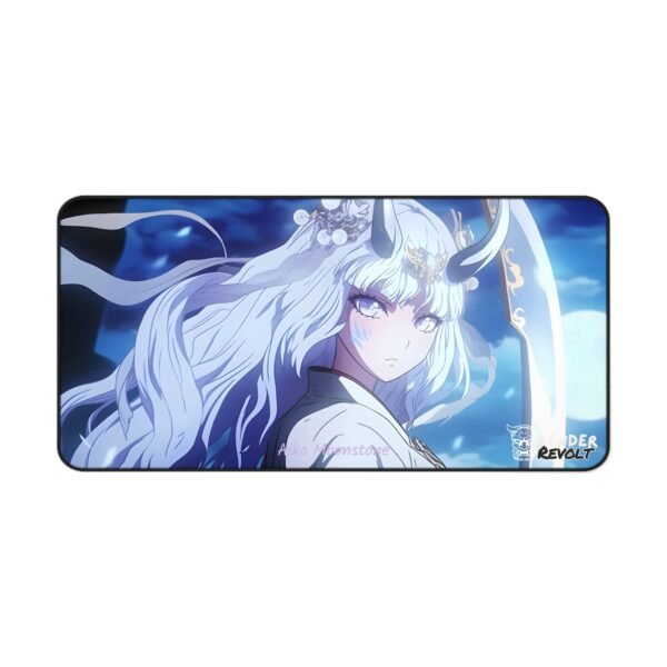 A large mouse pad laid out on a minimalist dark workspace, displaying an anime character with long, flowing white hair, black horns, and glowing blue eyes. She holds a golden-bladed sword and wears an ethereal outfit, with soft light illuminating her from the side.