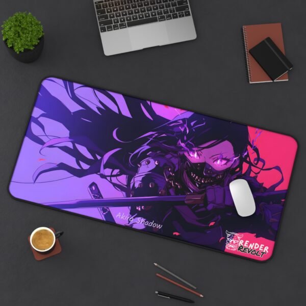 A large gaming mouse pad featuring an anime-style illustration of a masked female warrior with glowing purple eyes and a katana, placed on a dark desk with a laptop, a cup of coffee, and stationery. The pad has a "Render Revolt" logo and the name "Akira Shadow" printed on it.