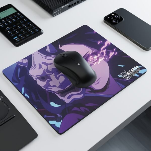 Anime mouse pad featuring a mysterious character with glowing eyes and detailed mask, set on a clean desk next to a laptop and other items.