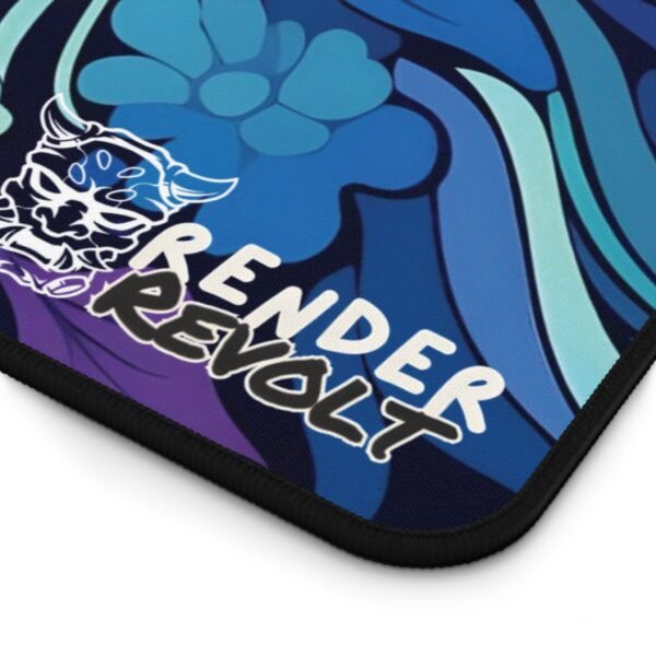 A zoomed-in view of the desk pad's corner, highlighting blue floral patterns with golden swirls, and the "Render Revolt" logo on a soft-textured fabric