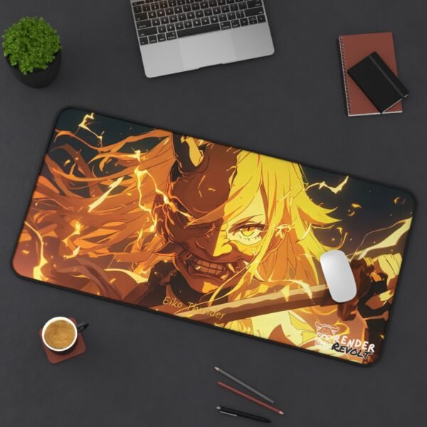Overhead shot of a large desk mat with a flame-themed anime character on a wooden desk.