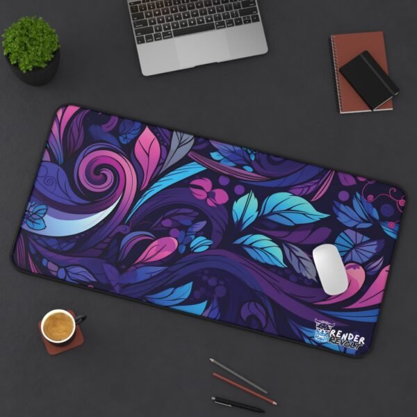 A dark-themed workspace featuring the floral-patterned desk pad, neatly placed with a laptop, mouse, coffee cup, and colored pencils.