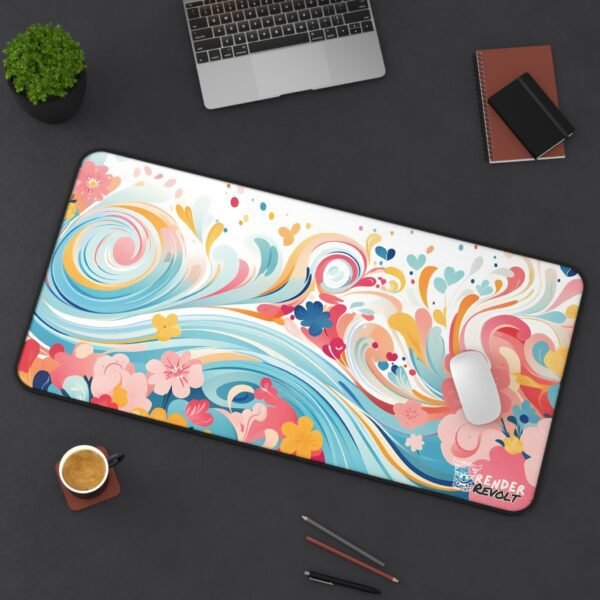 Modern office setup featuring a curved monitor, a white PC, and a pastel wave-patterned desk mat in soft blue and gold hues.