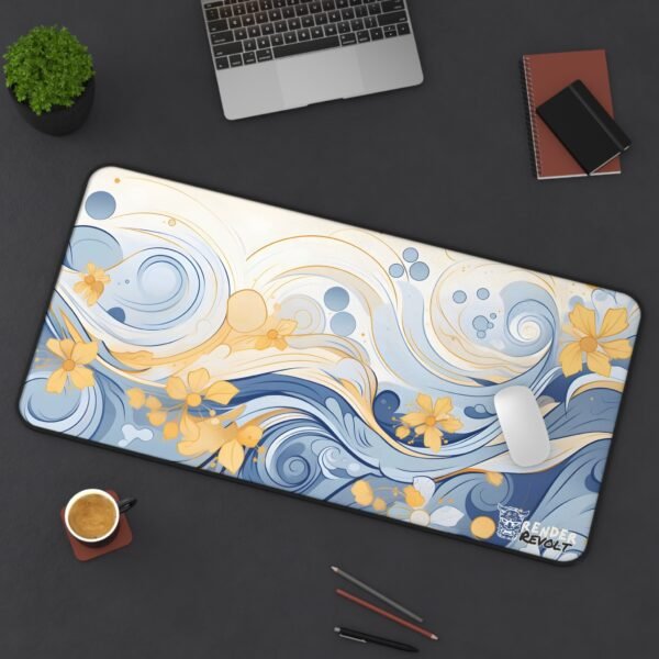 Overhead view of the blue and gold floral wave desk mat on a modern desk setup, with a white mouse resting on the surface