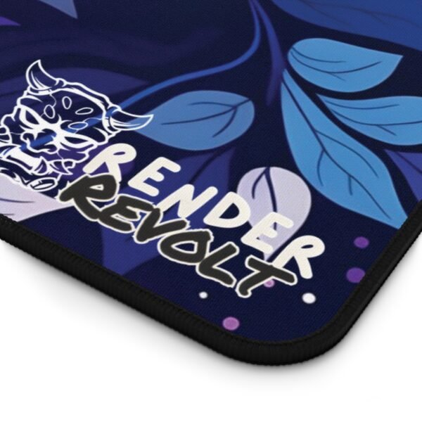 A close-up of a rectangular desk mat with a swirling floral pattern featuring pink, blue, and golden hues.