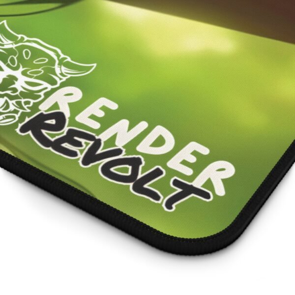 Close-up of the "Render Revolt" branding on a green desk pad, showing its stitched edges and smooth fabric.