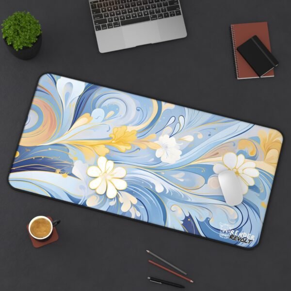 A full view of a desk pad with a colorful, tropical floral-inspired design with flowing elements in shades of orange, teal, and pink.