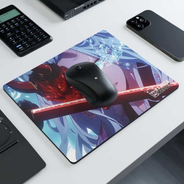 A modern workspace with a black wireless mouse resting on a vibrant anime-style mouse pad, depicting a determined character with piercing blue eyes, a demonic red mask, and a glowing katana.