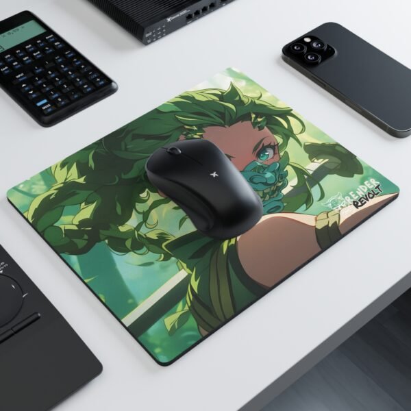 A mouse pad with an illustrated green-haired warrior wearing a dragon-themed mask, set on a white desk with a black wireless mouse, a calculator, a smartphone, and other office accessories.