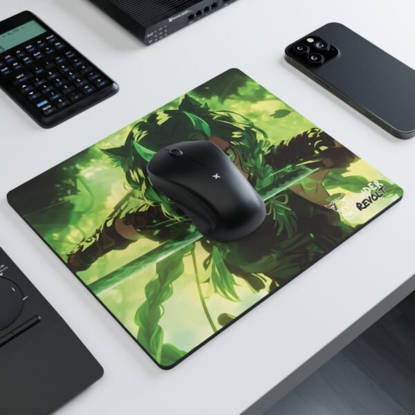 A mouse pad with an intense anime-style character wielding a glowing green sword, set on a dark wooden desk beside a laptop and a small potted plant.