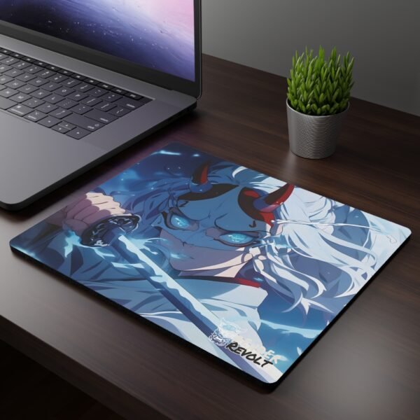 Mizo Demon Mouse Pad - A mouse pad featuring an anime-style warrior with glowing blue eyes, a fierce expression, and a red-horned demon mask, gripping a katana, placed on a dark wooden desk beside a laptop and a potted plant.