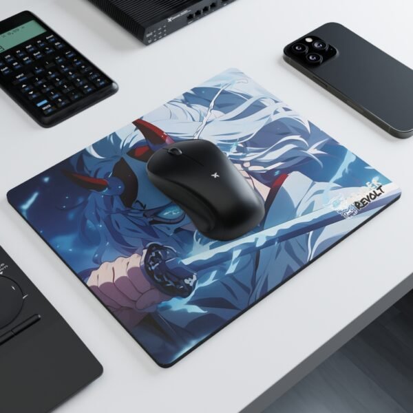 A mouse pad with an intense anime-style character wearing a cracked demon mask and wielding a glowing blue katana, set on a white desk with a black wireless mouse, a calculator, and a smartphone.