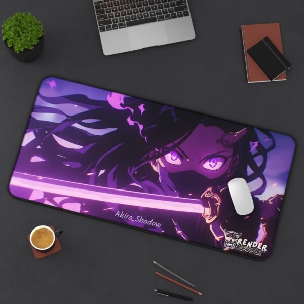 A large anime-themed desk mat placed on a dark desk, featuring the same masked female warrior with glowing eyes and a purple katana. A white mouse rests on the mat, and a laptop, notebooks, and a coffee cup are nearby.