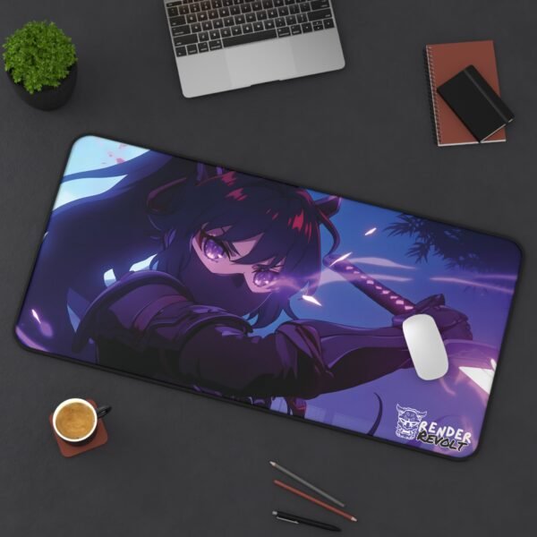 A large anime-themed desk mat featuring a female warrior with long flowing hair, a demon mask, and glowing purple eyes. She wields a katana under a dark purple sky with red embers. The text "Akira Shadow" and "Render Revolt" appear on the mat. The mat is placed on a black desk with a laptop, coffee cup, and notebooks nearby.